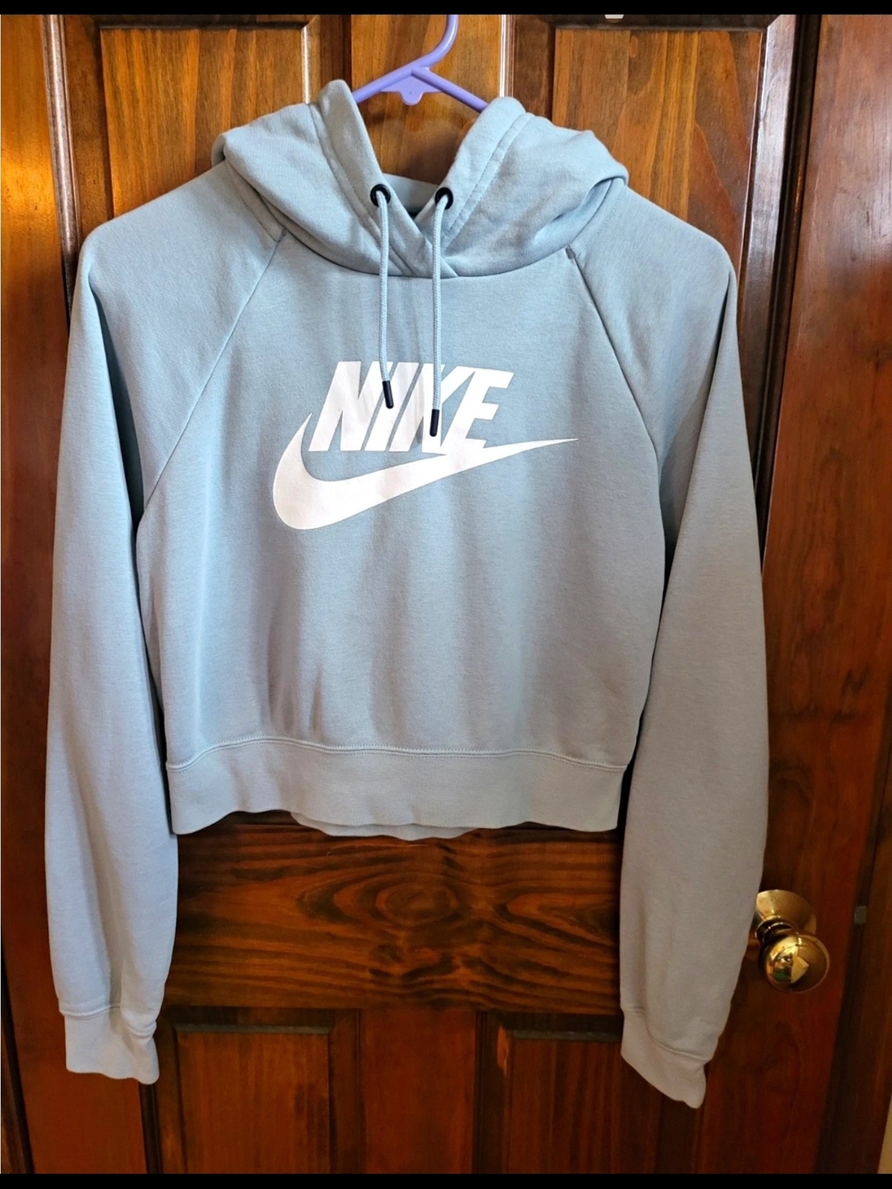 Nike Women's Pale Blue Cropped Hoodie with White Logo